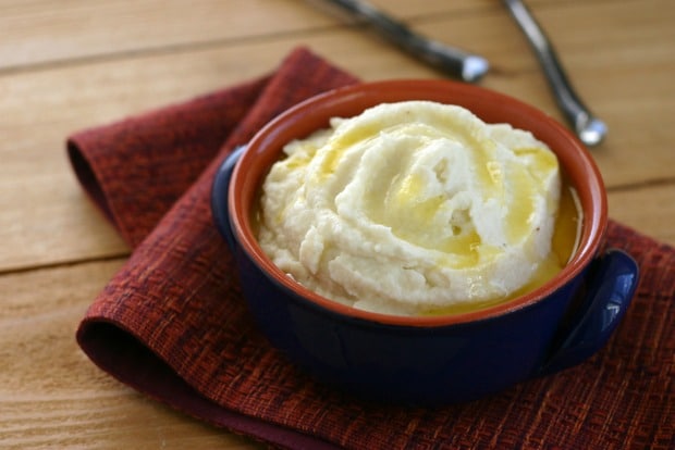 bowl with mashed cauliflower topped with melted ghee