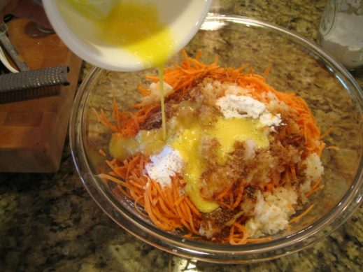 mixing ingredients for Sweet Potato Latkes in a large glass mixing bowl