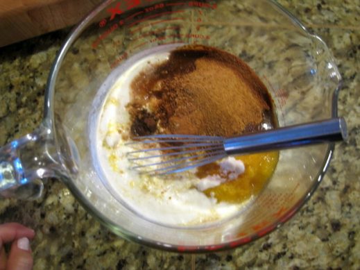 glass measuring cup with ingredients for paleo pumpkin pie filling