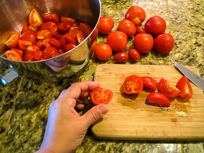 chopping jersey tomatoes to make tomato salad
