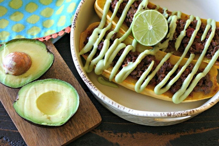 Taco Meat Stuffed Delicata Squash with Avocado Crema from www.EverydayMaven.com