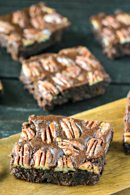 squares of pecan brownies on a serving board