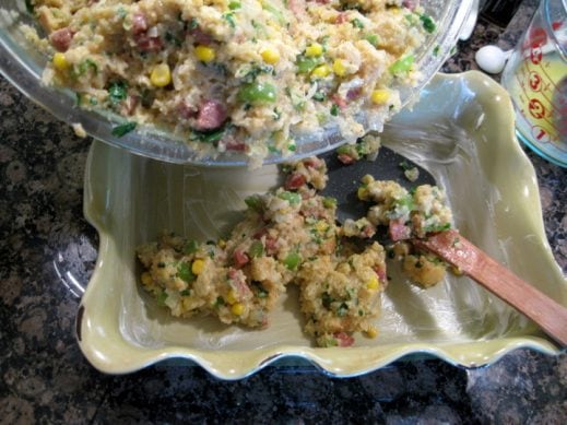 transferring cornbread sausae stuffing to a greased baking sheet