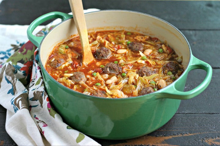 Italian Sausage Meatball Soup with Cabbage and White Beans from www.EverydayMaven.com