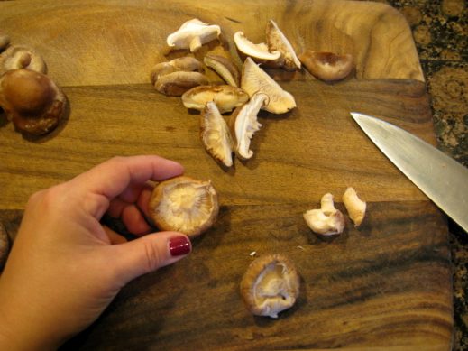 slicing shitake mushrooms
