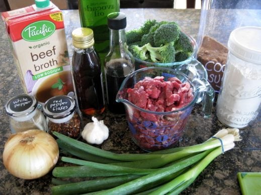 ingredients needed to make beef and broccoli piled on a kitchen counter