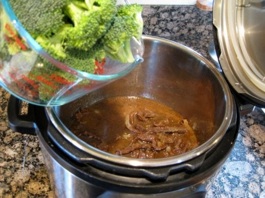 add broccoli florets into the the Instant Pot along with cooked beef for Beef and Broccoli