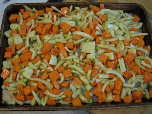 baking sheet with sliced fennel and diced sweet potaotes about to go in the oven