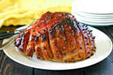 maple glazed smoked ham on a large serving platter