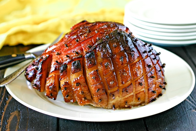 maple glazed smoked ham on a large serving platter