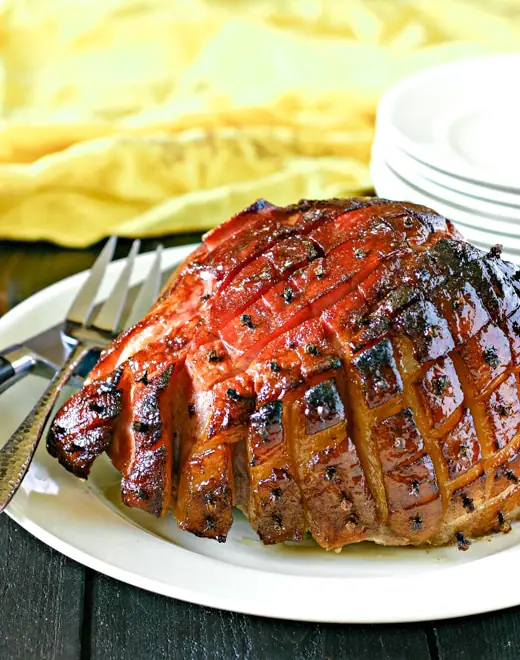 maple glazed smoked ham with serving plates