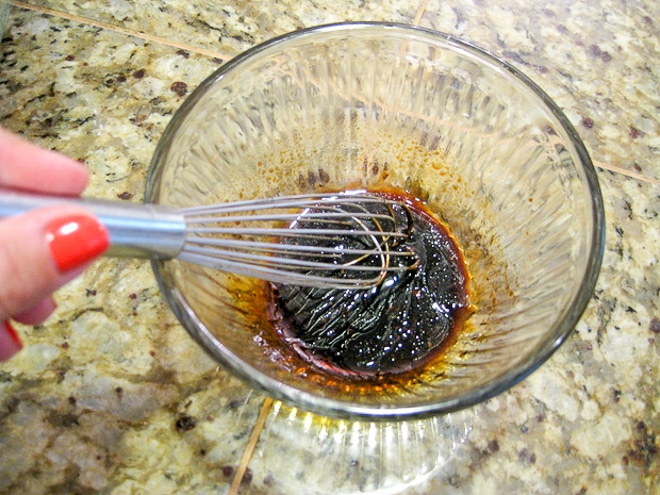 mixing easy balsamic dressing in a glass bowl