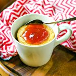 Peanut Butter Mug Cake topped with strawberry jelly