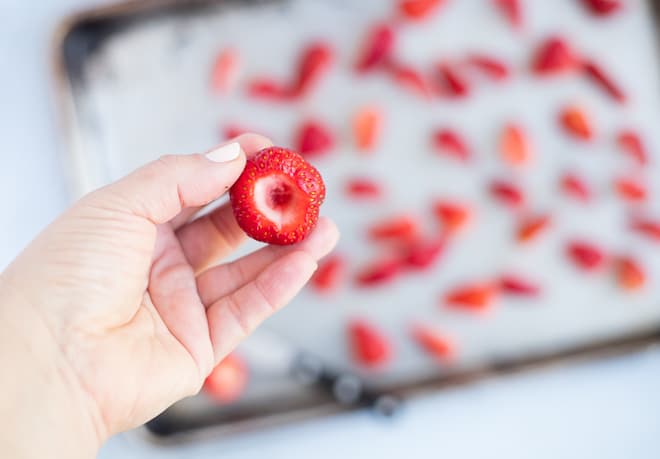 showing a strawberry with the top white section cut out for roasting
