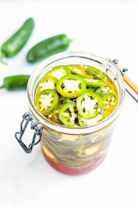 glass jar of homemade pickled jalapenos