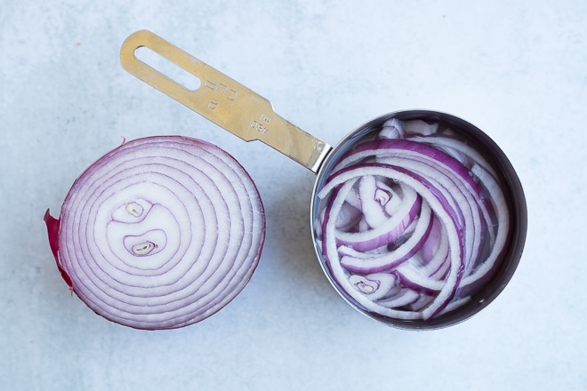 sliced red onion soaking in cold water