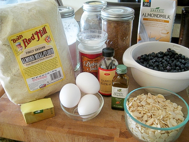 ingredients to make gluten-free blueberry muffins on a cutting board