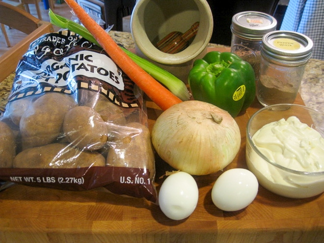 ingredients for classic potato salad on a cutting board