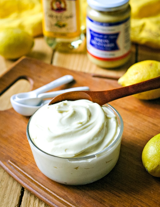 easy homemade mayo in clear container in front of lemons