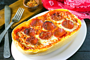 low carb pizza made with spaghetti squash and topped with pepperoni