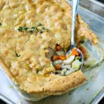 close up of cooked paleo chicken pot pie with serving spoon scooping some out