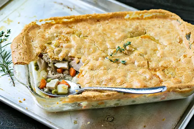 A slice of chicken pot pie with a flaky grain-free crust
