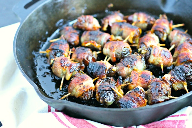 cast iron skillet with bacon wrapped dates