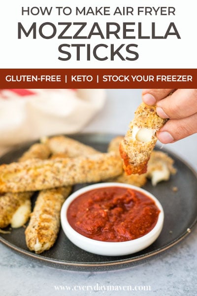 picking up a cooked mozzarella stick and dipping it into pizza sauce