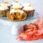 carrot oatmeal muffins on a metal cake stand