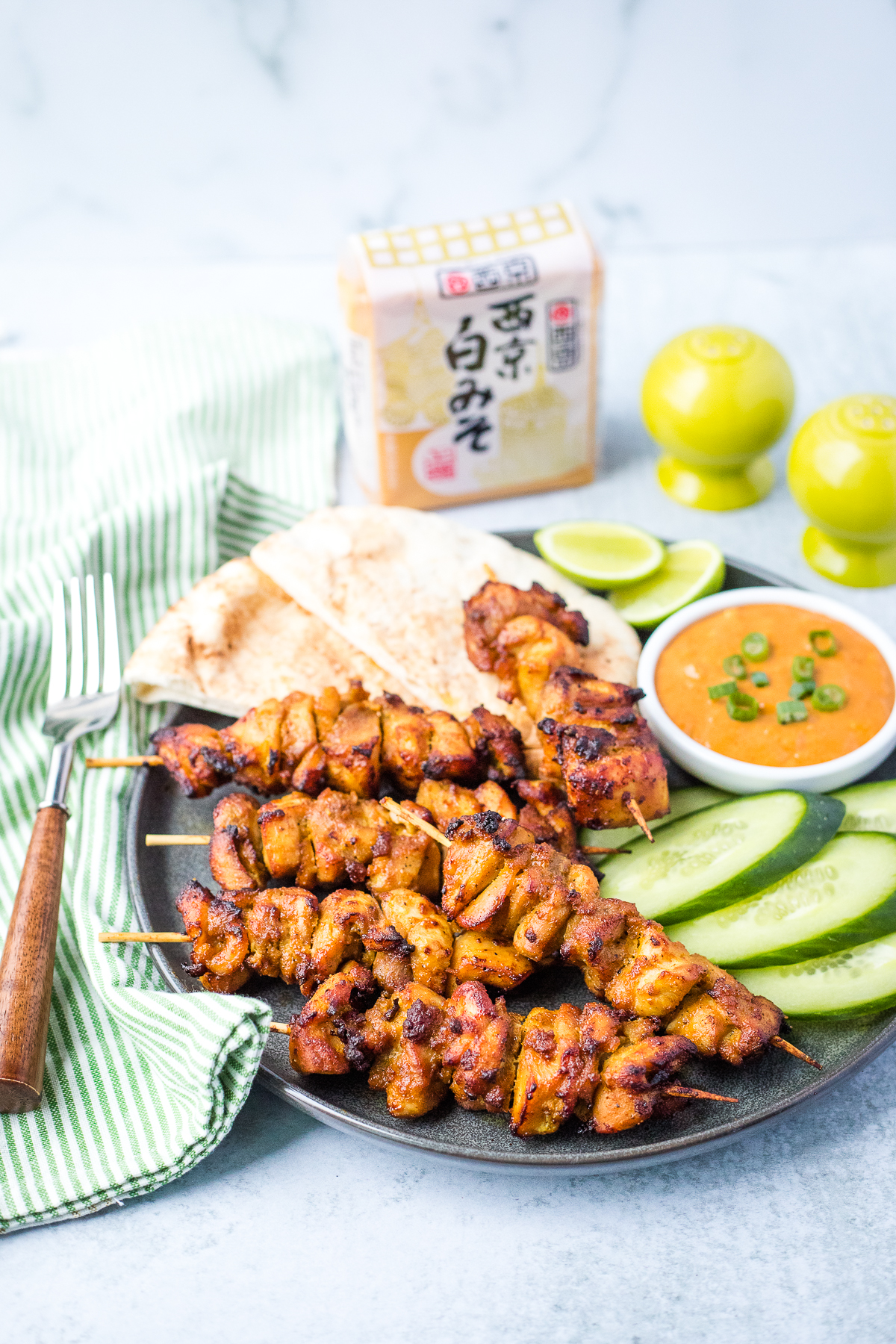 platter of cooked air fryer chicken kebobs with saiyko white miso package